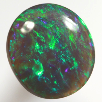 SOLID BLACK OPAL Bright gemmy fire in a Green Harlequin pattern SEE VIDEO